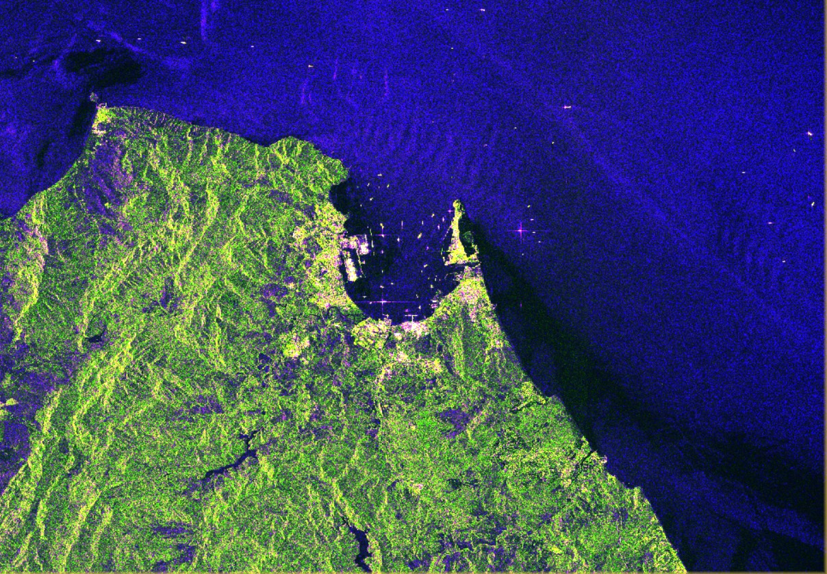 Radar image of the Strait of Gibraltar: textured land in green and yellow, dark blue sea, and ships as bright points in the bay and the strait.